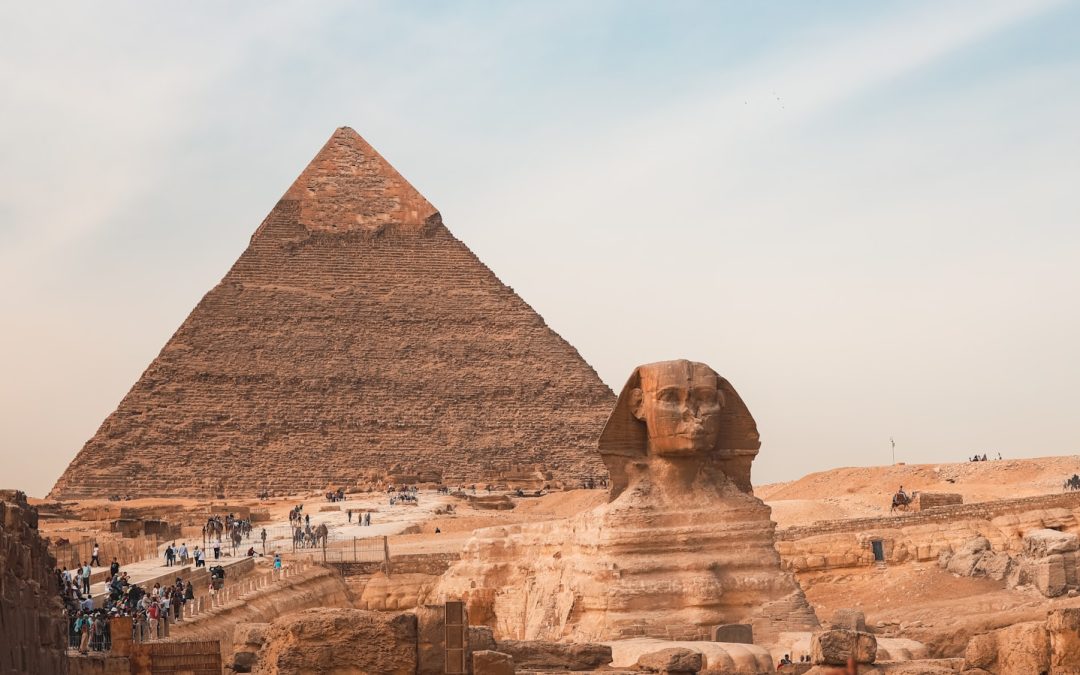 The great pyramid and sphinx stand together in egypt.