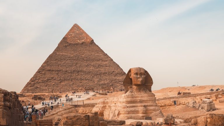 The great pyramid and sphinx stand together in egypt.